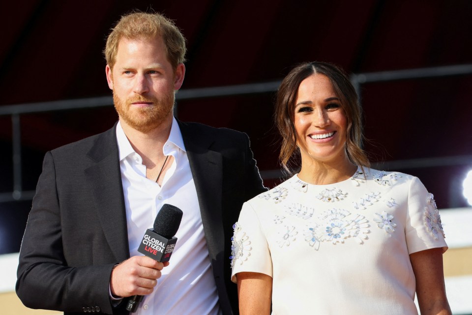 Prince Harry holding a "Global Citizen Live" microphone, and Meghan Markle smiling onstage at the 2021 Global Citizen Live concert.