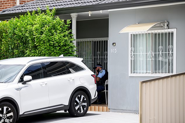 Police are pictured at a Campsie rental property where the pair were allegedly staying in the lead up to the shooting