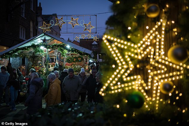 Cosy Christmas lights in the shapes of stars and other festive imagery light up York, which is also known for its winter market