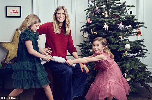 Many of us are spending money we don’t have because we’ve bought into the idea that gifts are what a happy Christmas is all about, writes Dinah, pictured with Lyra and Sasha
