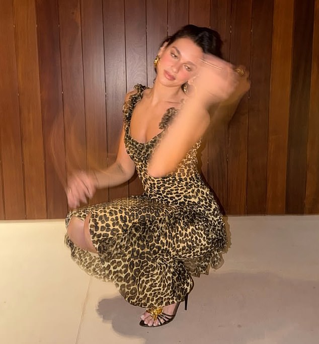 Loving the leopard print she later slipped into a printed gown