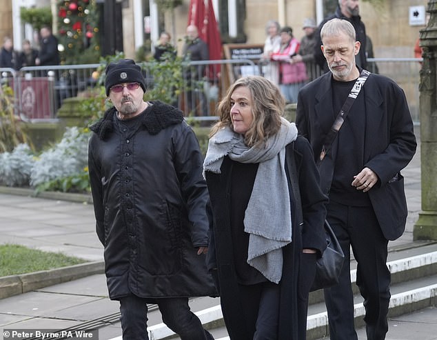 Paul 'Bonehead' Arthurs (left) from Oasis was also seen arriving for the funeral service