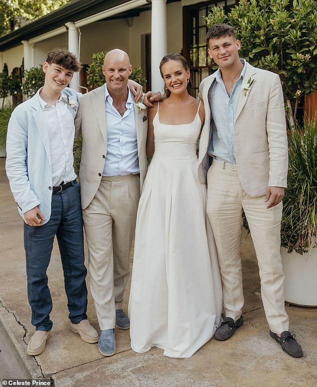 The happy couple with Sir Andrew's sons, Luca (left) and Samuel (right)