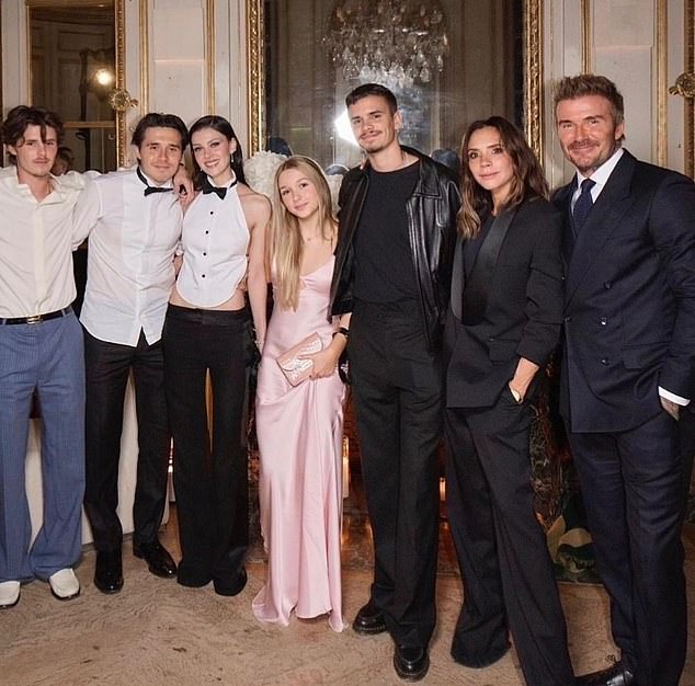 The Beckham clan comprises L-R Cruz, 20, Brooklyn, 26, Harper, 14, Romeo, 23, Victoria, 51, and David, 50 (pictured last year alongside Nicola, third left)