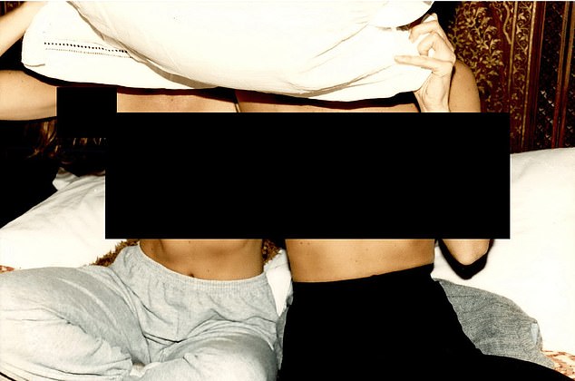 A photograph of two woman without shirts features in the released files