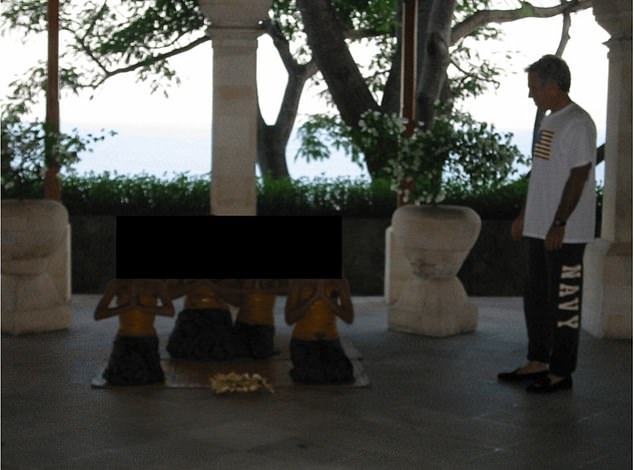 Epstein is seen at an undisclosed location, watching people meditate