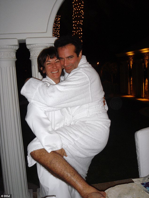 Ghislaine Maxwell is pictured with David Copperfield, both wearing white robes