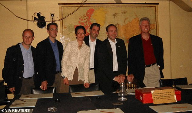 Kevin Spacey (second from the right, next to Clinton) was also pictured in the files, seen here in the Churchill War Rooms in London. Ghislaine Maxwell is wearing a cream blouse
