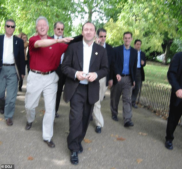 In one image shared Friday, Clinton was seen with his hands on the shoulders of Kevin Spacey