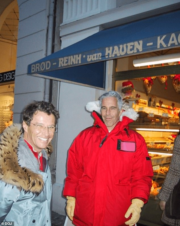 Epstein bundled up and smiling next to what appears to be French model scout Jean-Luc Brunel