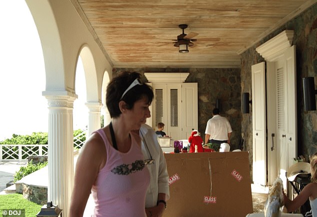 Maxwell is pictured alongside two men and a young woman