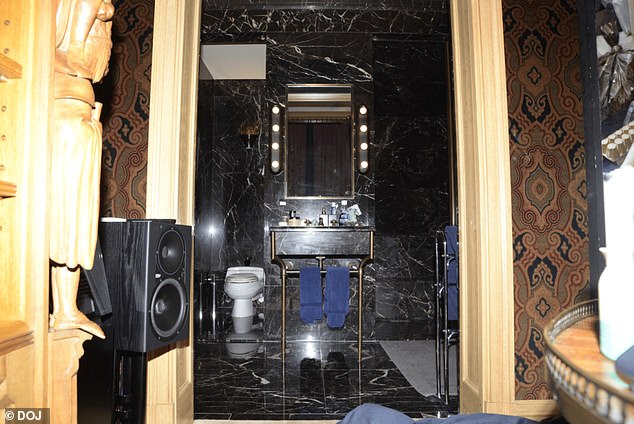 A black marble bathroom in Epstein's home is pictured in photo released by the DOJ