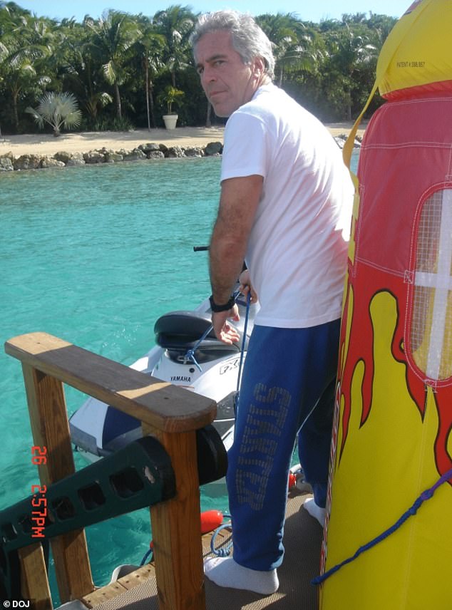Epstein pulls on a cord attached to a Yamaha jet ski while on board a marina