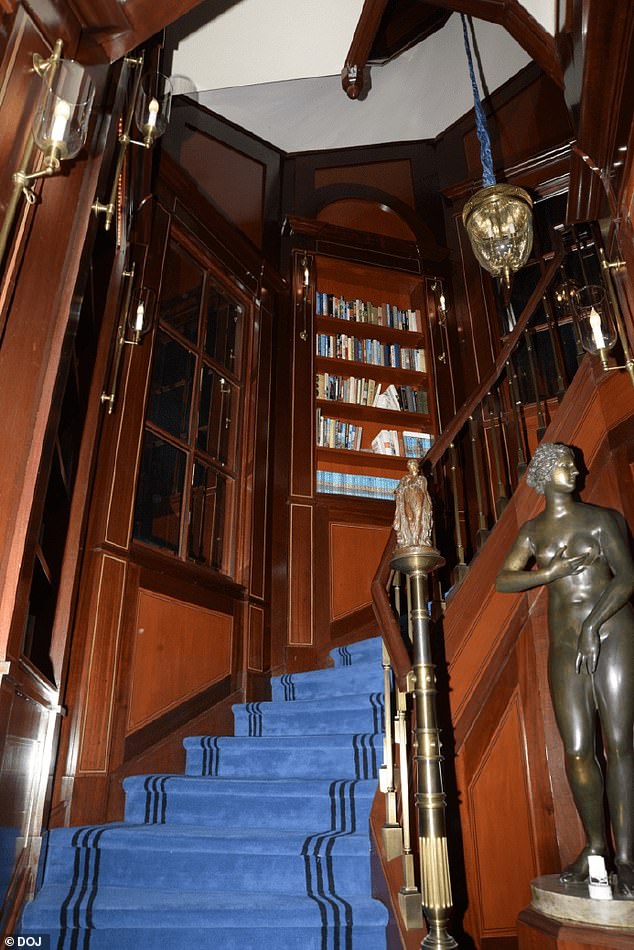 Statues decorate a staircase within Epstein's home