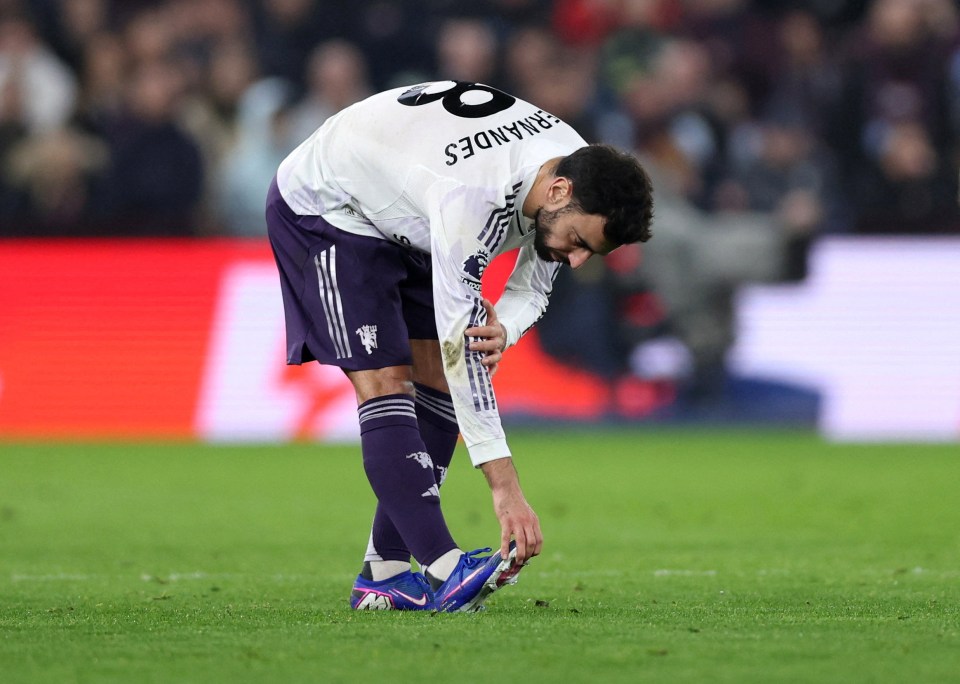 Manchester United's Bruno Fernandes reacts after sustaining an injury.