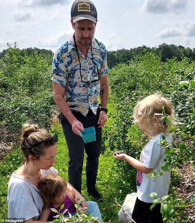 James, Jamie and their two children are pictured in 2023