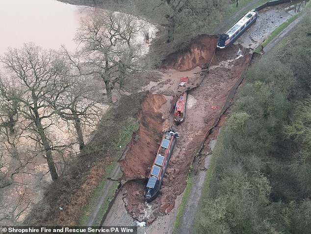 Aerial images show the destruction caused to two of the boats which have been left at the bottom of the sinkhole