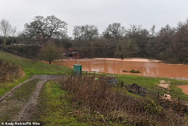 Floodwater spilled out onto a nearby field after much of the canal was drained