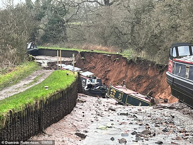 Three boats remain at the bottom of the sinkhole, while others remain stuck on the bottom of the canal