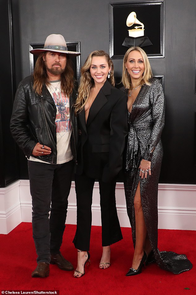 A woman in Arizona has filed a bizarre lawsuit claiming she is the biological mother of the Disney Channel star (pictured with parents Billy Ray and Tish)