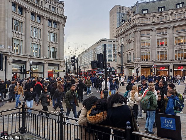 A busy Oxford Street on December 21 as shoppers braved the streets of London to buy last-minute gifts