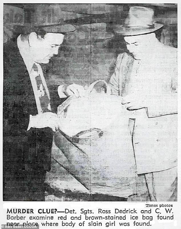 A photo in a newspaper shows police officers looking at a canvas iceman¿s bag marked with a letter ¿Z¿ found close to where Short's body was found. Baber believes this supports his theory about the Zodiac Motel