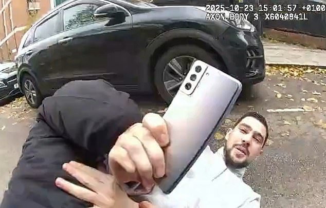 After bumping into a parked car, Ghilas gets up again to make one last attempt to avoid arrest but is eventually wrestled onto the tarmac by officers who also snatch a phone from his hand