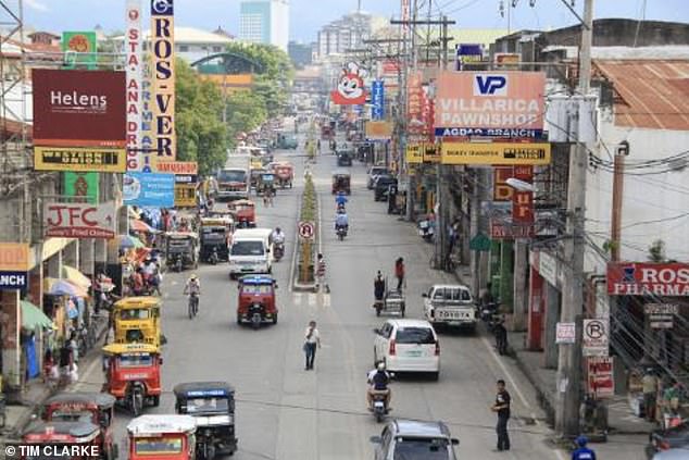 Sources on the ground in Davao (pictured) told the Daily Mail that the men had been accompanied by two other mysterious companions