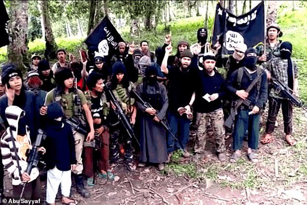 The suspects based themselves on the island of Mindanao ¿ the most notorious area in all of Southeast Asiafor Islamic extremists. The Abu Sayyaf group (pictured) exist there known for kidnappings, bombings, assassinations and extortions
