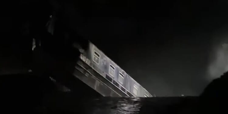 Moment 164ft sinkhole swallows canal boat in 'major incident' as 10 people rescued