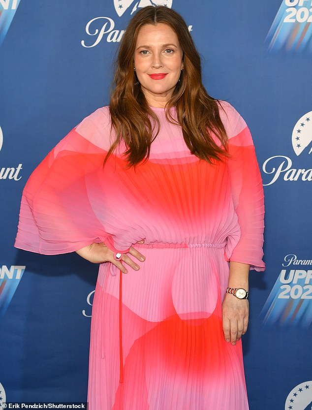 The actress (seen in May 2022) now jokes that she's grateful for getting 'midlife crisis, institutionalized, blacklisted, no family' done by 14