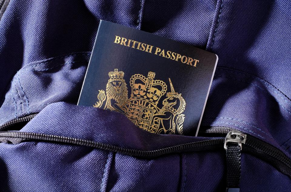 A British passport in a blue bag pocket.
