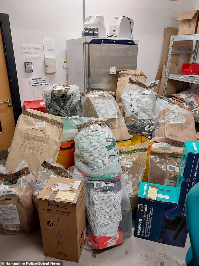 An Evri subcontractor was arrested by Hampshire Police on Monday after up to 120 parcels were stolen just days before Christmas. Pictured is a photo of the stash