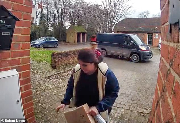 Video filmed in Timsbury, Hampshire captured the moment an Evri delivery driver appeared to steal a Christmas present from a customer's doorstep. Evri said it was investigating the incident