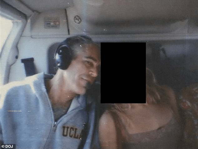 Epstein pictured in a helicopter with a redacted woman, in a document released by the Department of Justice on December 19, 2025