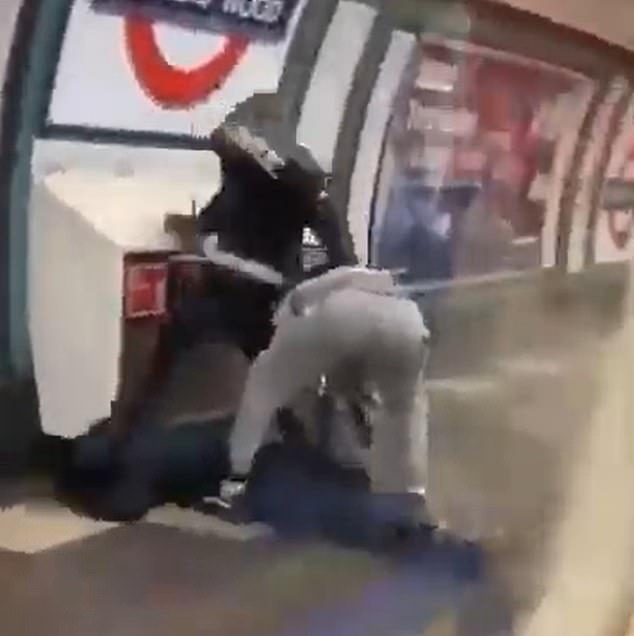 The youth dressed in the black hoodie is seen stamping his victim's head into the ground in the knife fight