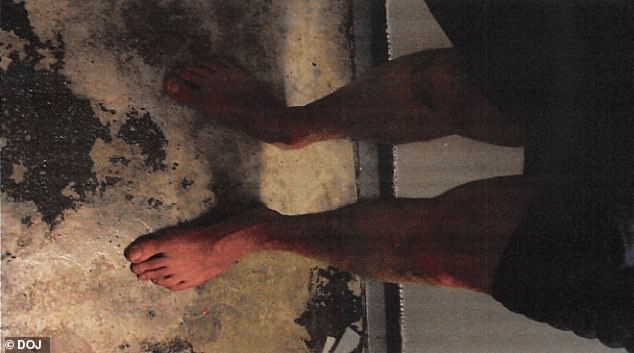 A photograph of Epstein's feet in his cell attached to the document about the 'possible suicide attempt'