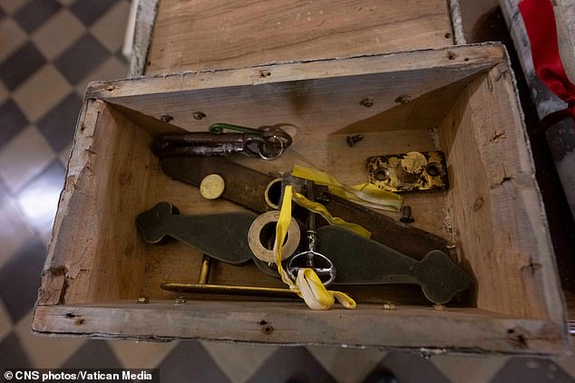 The Catholic church began the ritual in December 2024, praying at the door in St Peter's Basilica and removing a metal box  (pictured)that held a key, which was followed by ceremonies at the other four doors