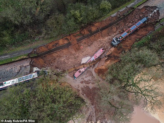 Two boats were sucked into the hole while a third teetered on the edge and seven more were left sitting a the bottom of a dry canal