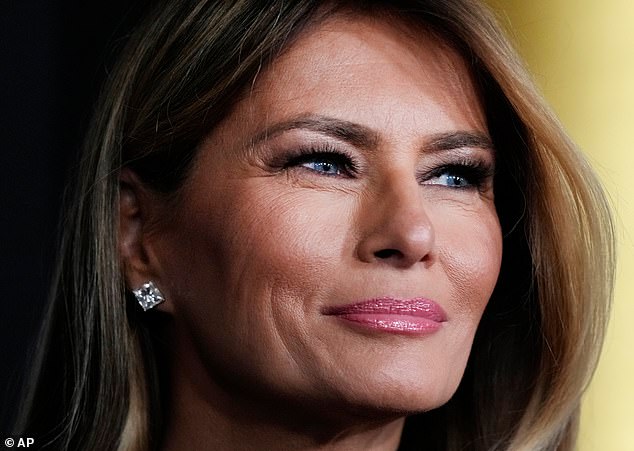Melania (seen here earlier this month) wore a long, sleeveless black dress complete with minimal pearl earrings and a diamond bracelet in the holiday snap