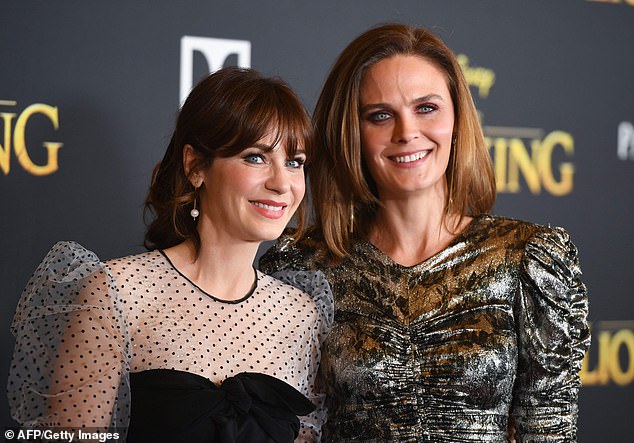 Zooey Deschanel (L) and her sister actress Emily Deschanel arrive for the world premiere of Disney's The Lion King in Hollywood in 2019