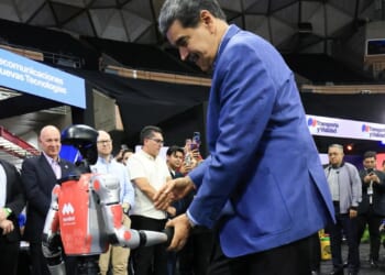 Awkward moment Venezuela tyrant Maduro salsas with robot as US flies special operations troops into Caribbean