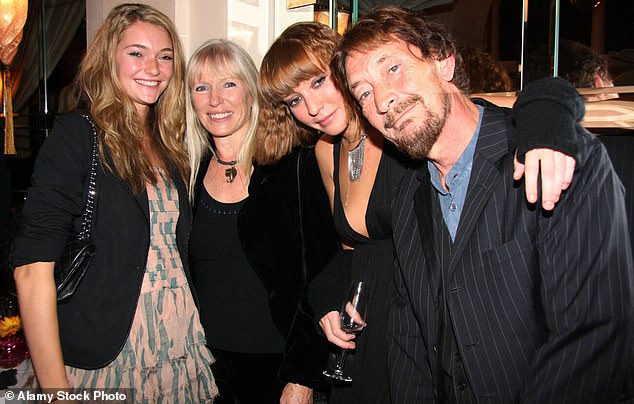 'He lived with his wife and children in Buckinghamshire. He always kept very close to his family,' Chris's sister continued. Pictured: Chris with his wife Joan and daughters Julia, left, and Josephine, second right