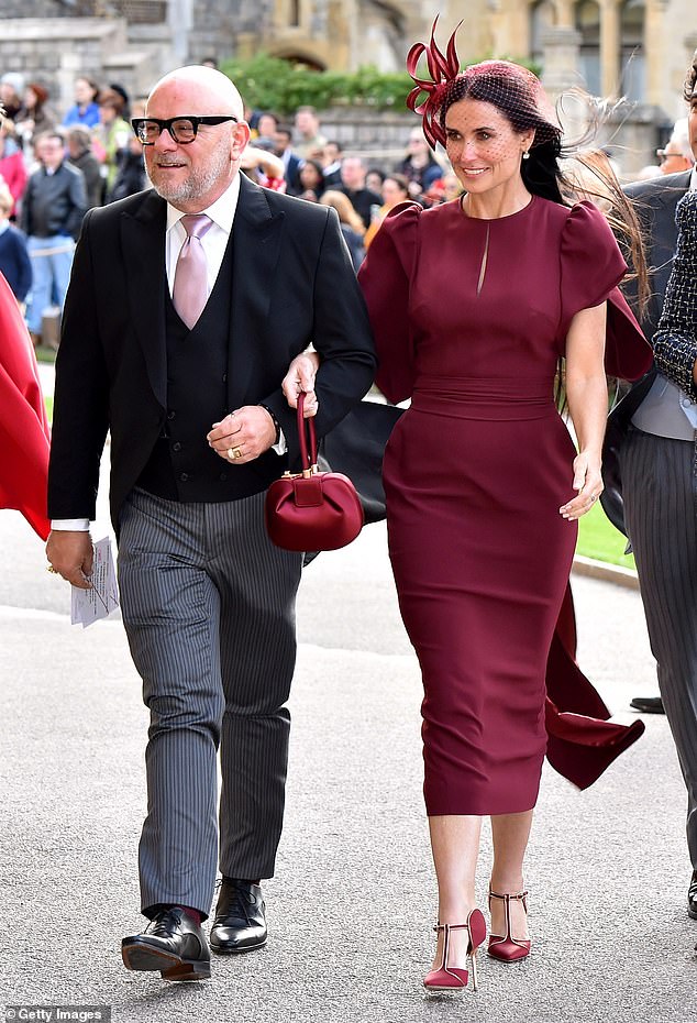 Demi Moore arrives ahead of the wedding of Princess Eugenie and Mr Jack Brooksbank at St George's Chapel on October 12, 2018, in Windsor
