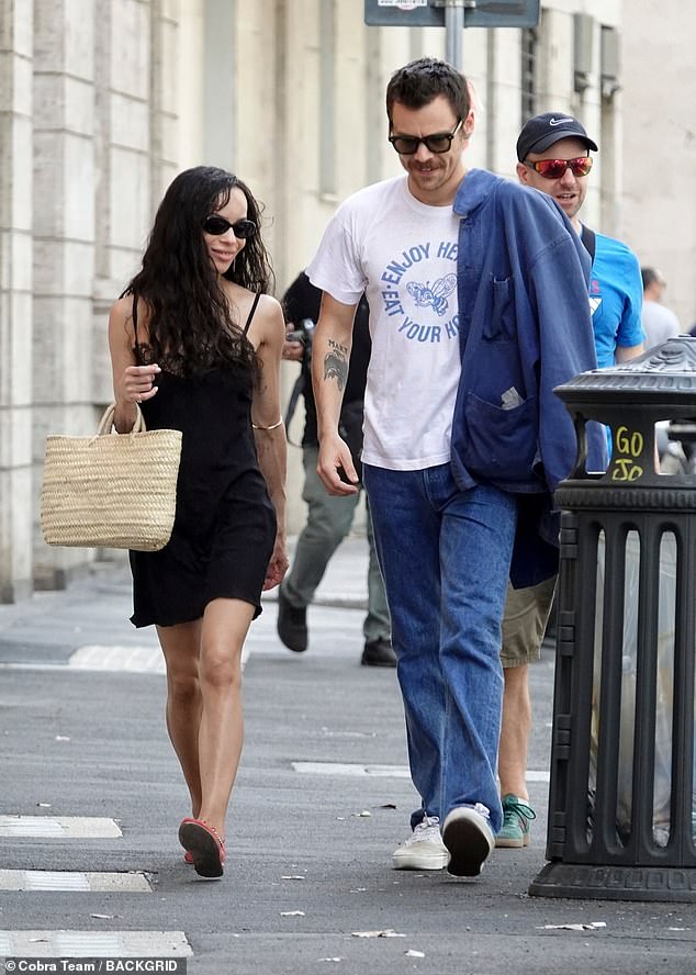Harry is now 'head over heels' in love with actress Zoe Kravitz and the two of them are regularly spotted strolling around Rome - where he owns a home (Seen together in September)