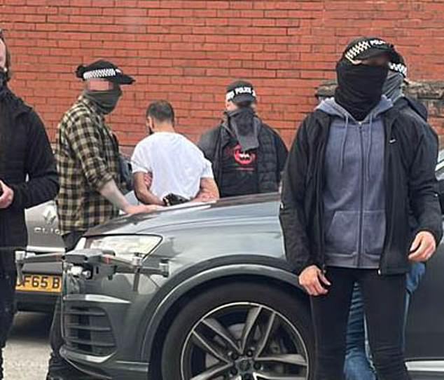 Bilel is seen standing upright after being arrested by police at The Warehouse Gym in Hindley in May last year