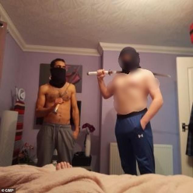 Bilel Saadaoui (left) pictured posing with a sword alongside his teenage stepson. He sought to characterise the picture as 'dress up'