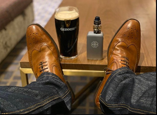 In one post he shared an image with his feet up, enjoying a Guinness and a vape