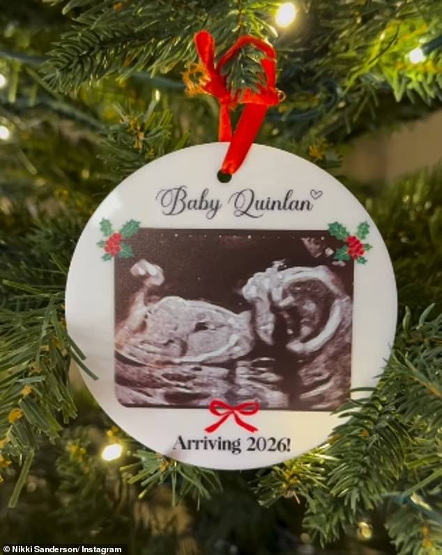 Sharing a sweet video of a Christmastree on Instagram on Wednesday, the pair zoomed in on a bauble which had an image of a baby scan