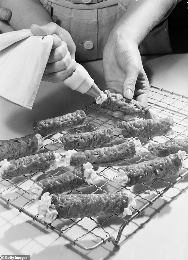 A photograph of brandy snaps being freshly piped in 1948. Despite the name, classic brandy snaps don't contain any alcohol